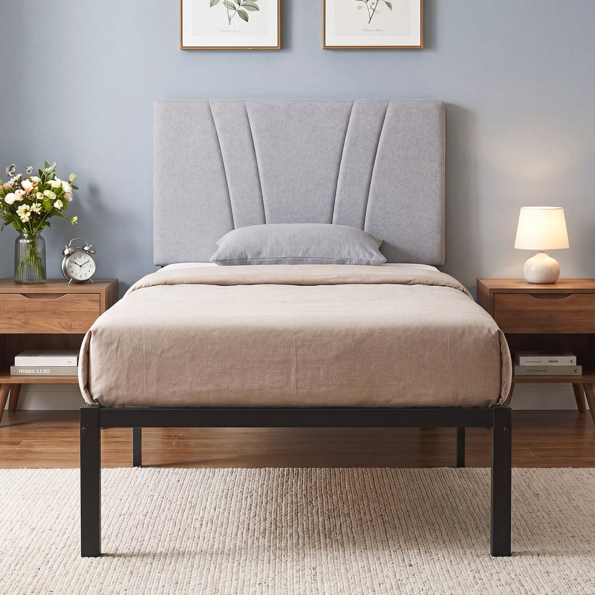 The single bed frame fully assembled with a mattress in a bedroom setting between two bedside tables
