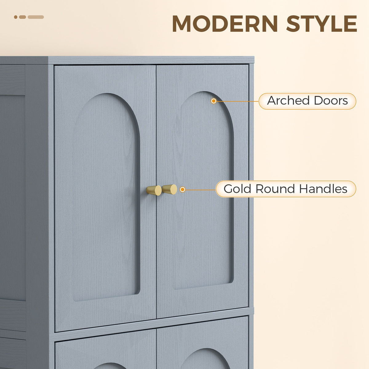Close-up of the grey kitchen furniture highlighting the arched doors and gold round handles