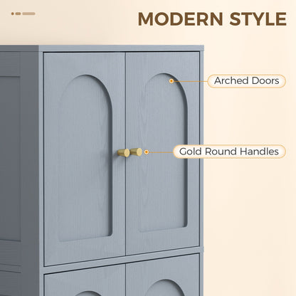 Close-up of the grey kitchen furniture highlighting the arched doors and gold round handles