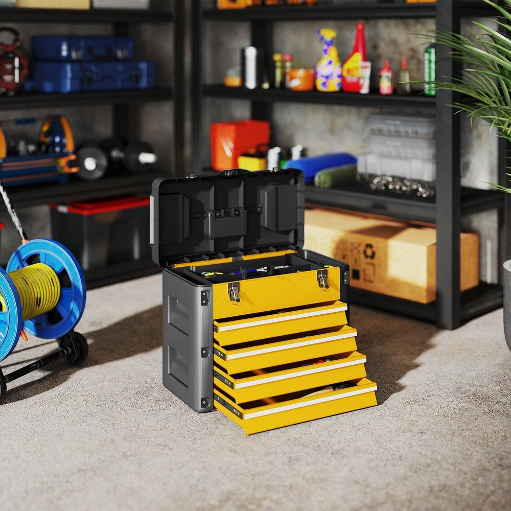 The yellow and black four drawer toolbox sits on a concrete floor in a garage setting