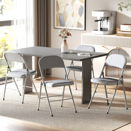 Four grey folding chairs around a dining table in a room setting