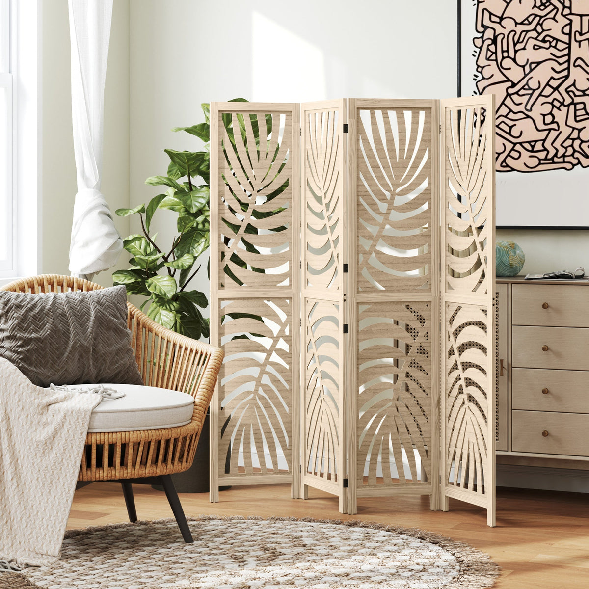 The four panel room divider is set up in a living room next to a chair and plant