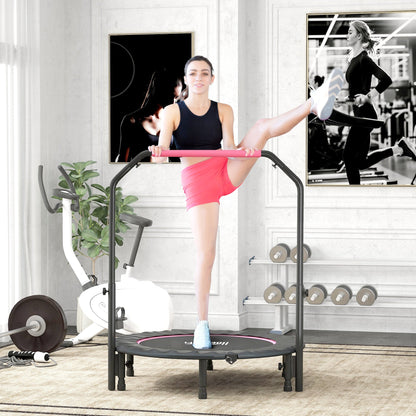 Woman exercising on the pink mini fitness trampoline in a bright room