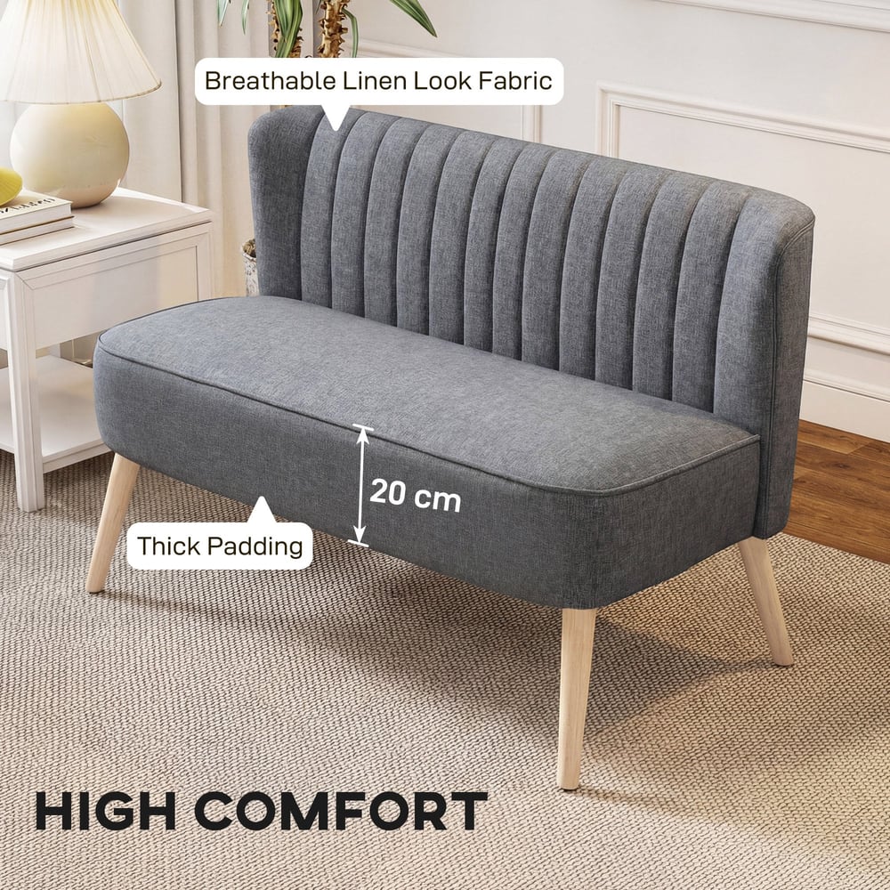 Close up of the small grey sofa showing thick padding on the seat