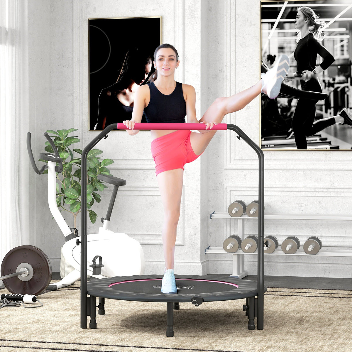 A woman exercising on the fitness trampoline in a bright home gym setting