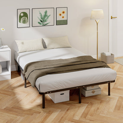 The black metal bed frame set up with a mattress and bedding in a bedroom