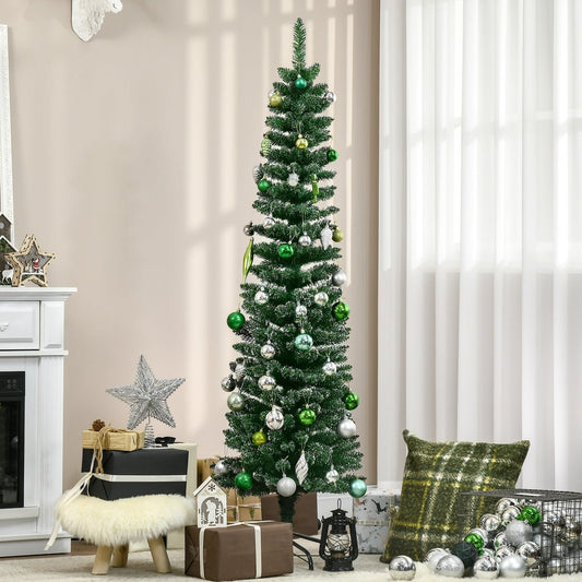 The artificial Christmas tree decorated with baubles in a living room setting with gifts underneath