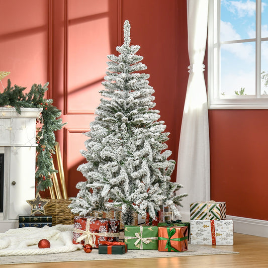 The snow flocked artificial Christmas tree decorated in a room with presents