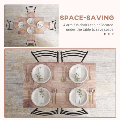 Four chairs tucked under the dining table to save space