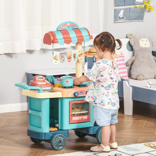 A young child playing with the kids kitchen play set in a room