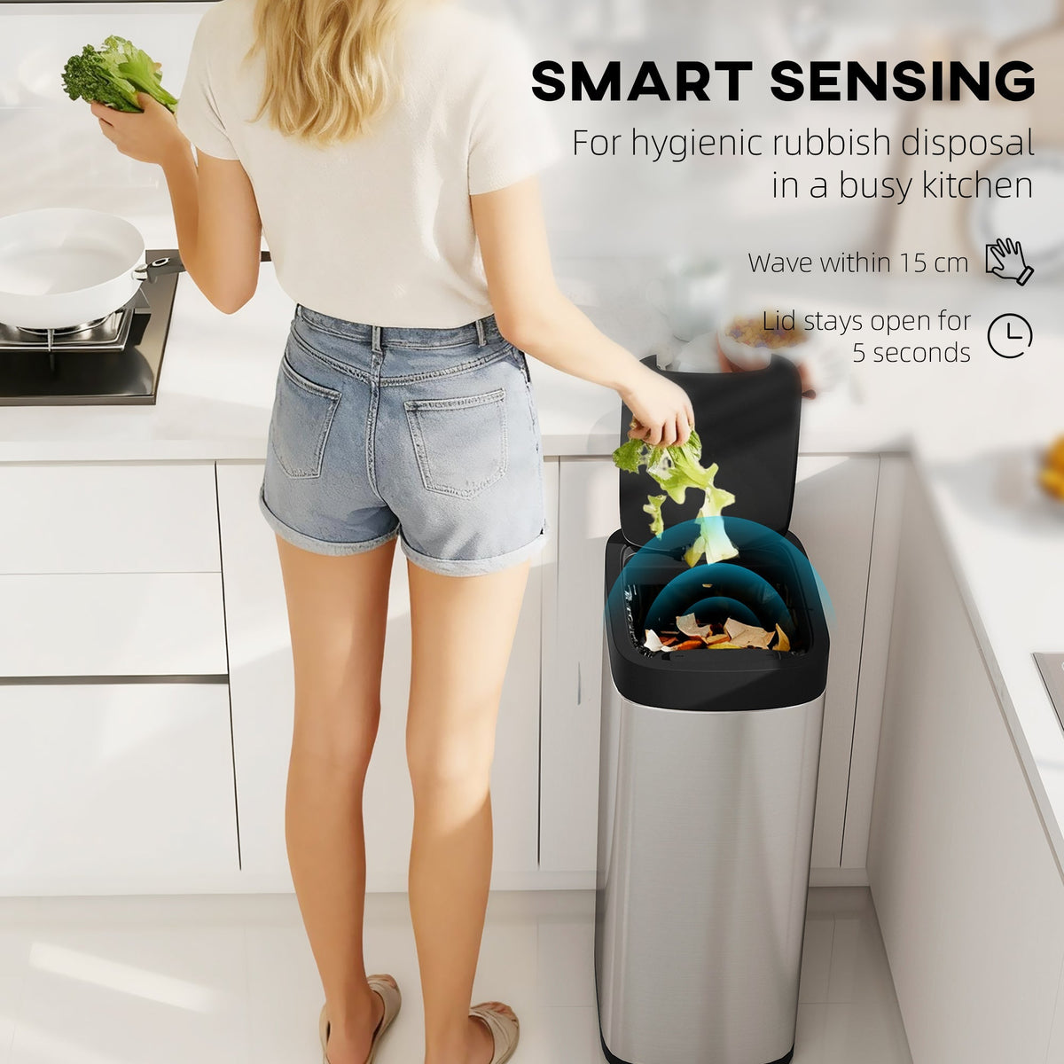 The cleaning bin lid opening automatically as a hand waves over the sensor in a modern kitchen