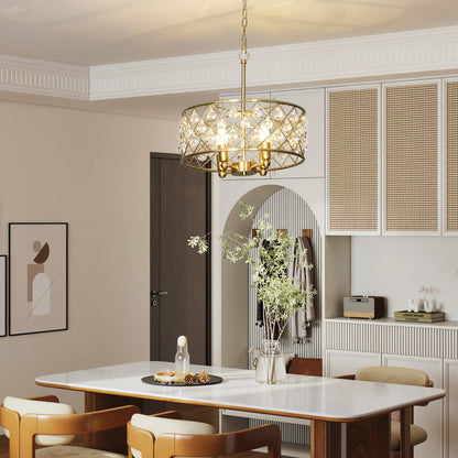 The gold-tone four-bulb chandelier hanging above a dining table in a bright room