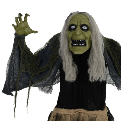 Close up of the hunchback witch Halloween animatronic's face and tattered clothing