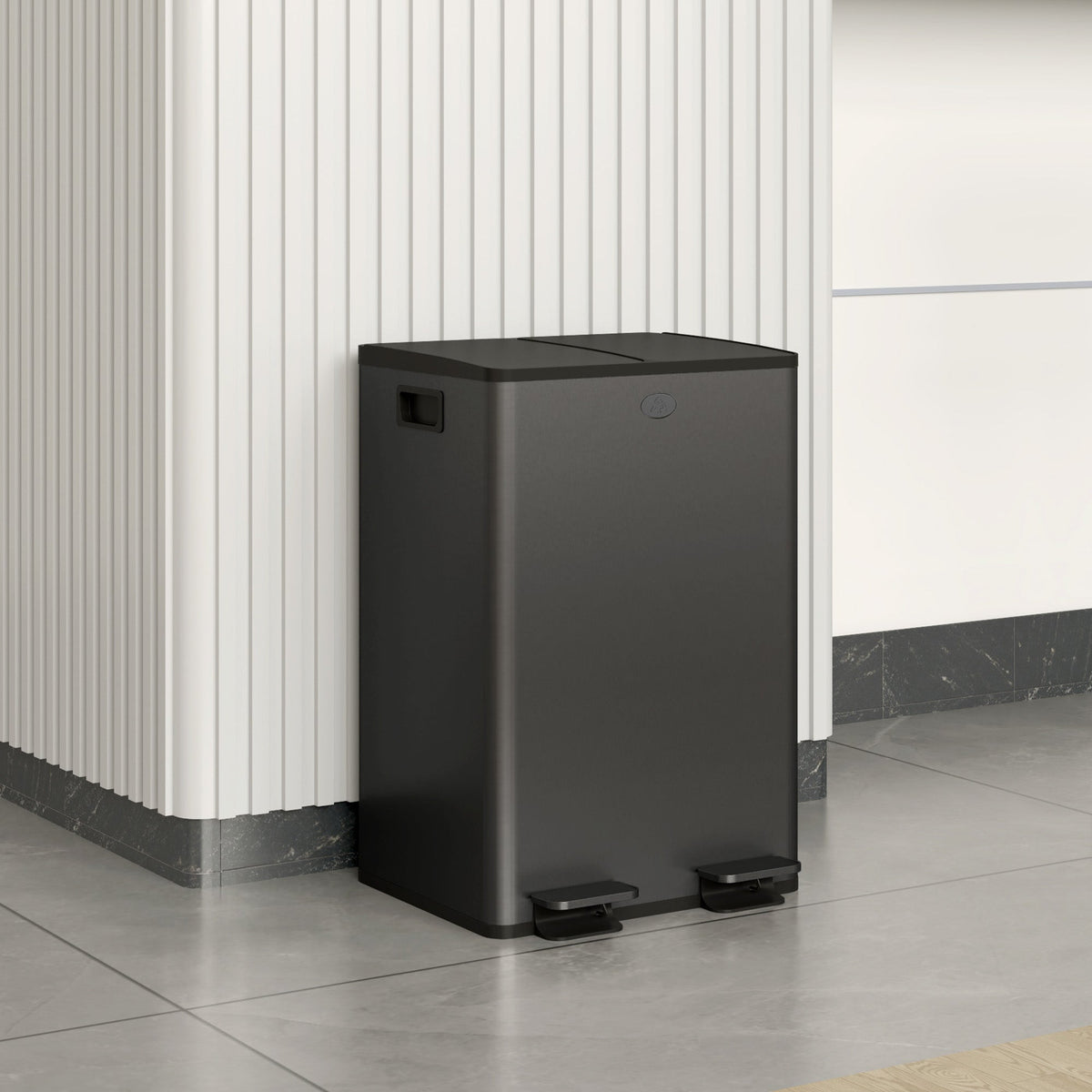 The black dual compartment bin is shown in a modern kitchen setting