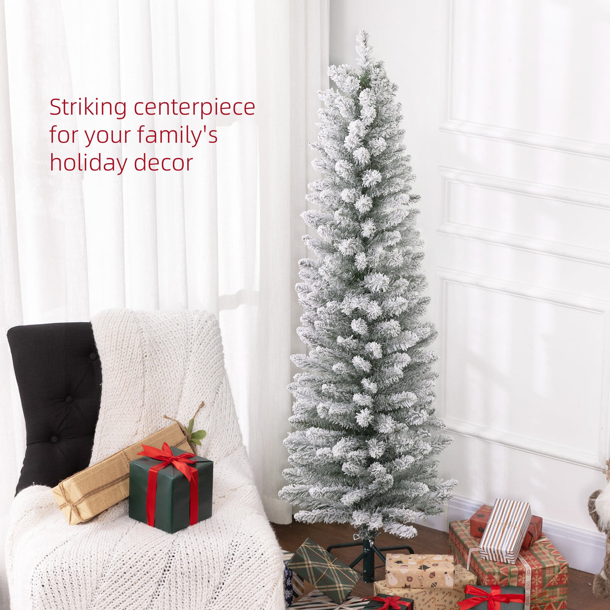 The slim snowy pencil Christmas tree as a centrepiece in a living room