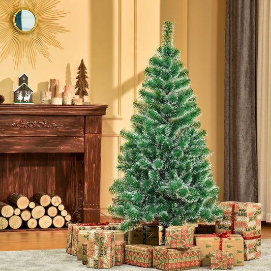 The artificial Christmas tree decorated with presents in a cosy living room by a fireplace