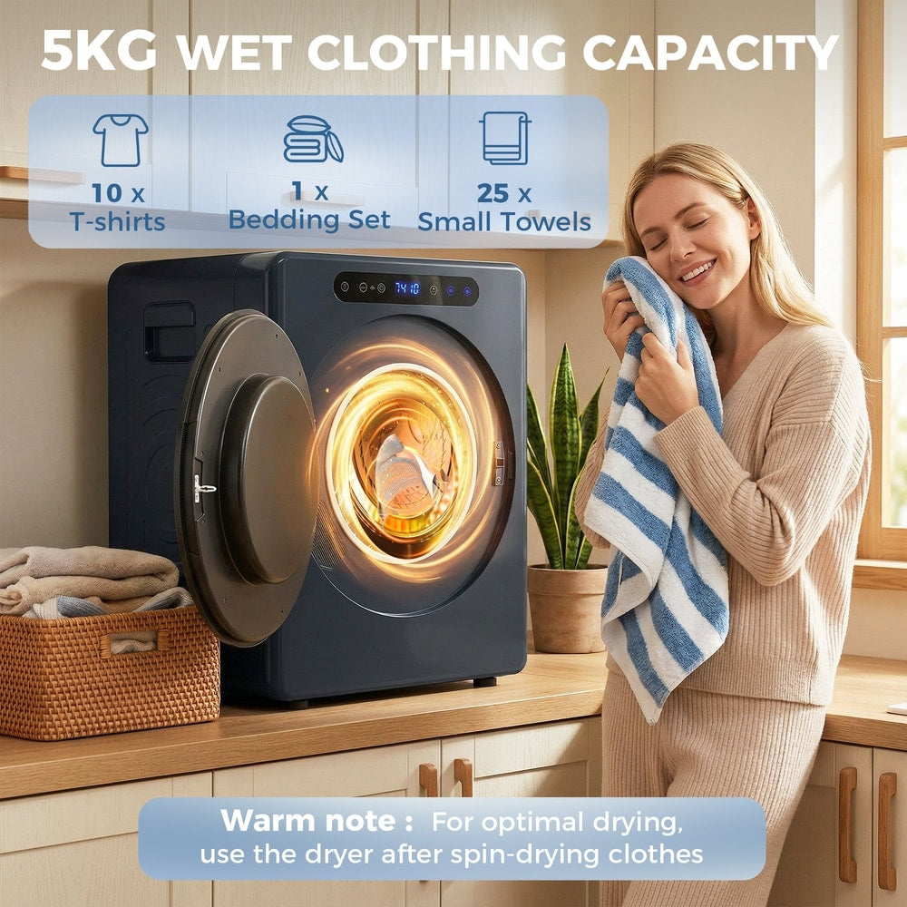 The tumble dryer with its door open showing clothes inside