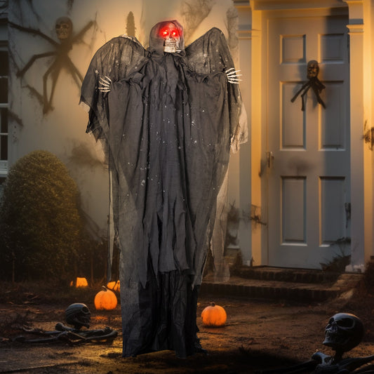 The grim reaper Halloween animatronic is displayed outdoors at night in front of a house with pumpkins and skeletons