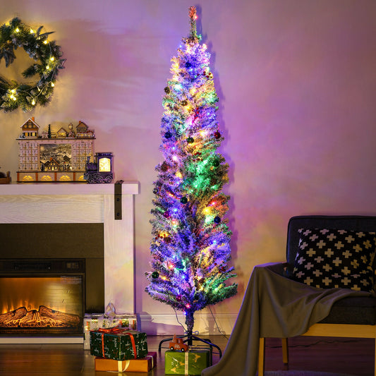 The pre lit Christmas tree is decorated with colourful lights and ornaments in a living room setting