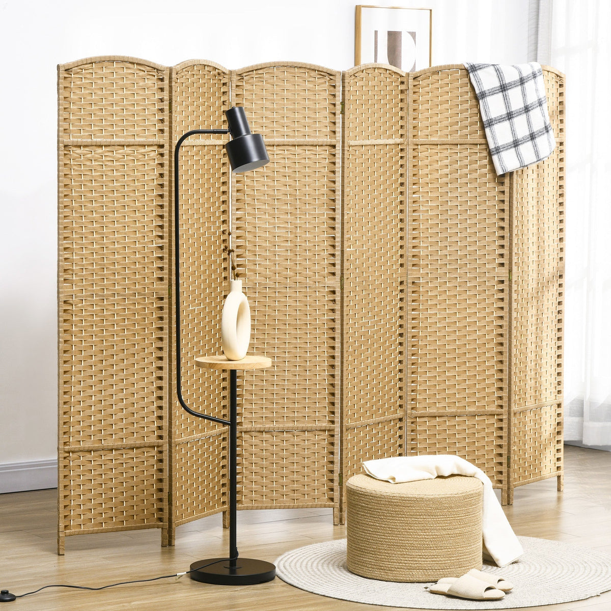 The folding room divider is shown in a living room setting, providing privacy