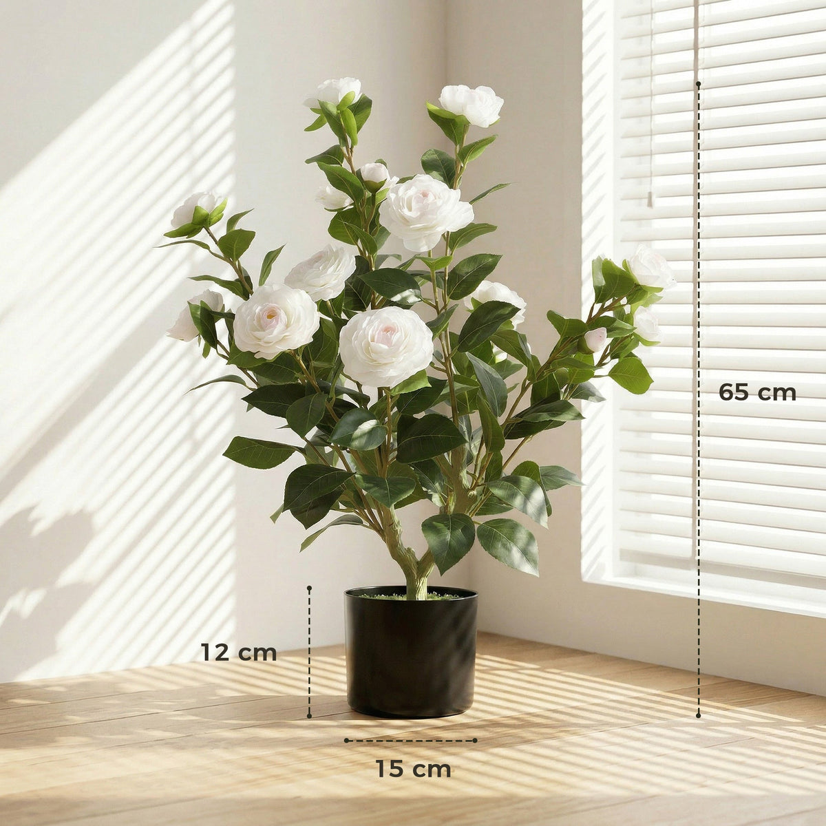 The artificial plant showing height and base width dimensions on a wooden surface