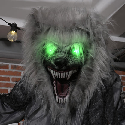 Close up of the werewolf animatronic's furry head and glowing green eyes