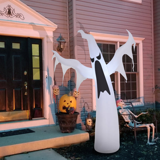 The Halloween inflatable decoration is placed on a lawn in front of a house with a skeleton decoration