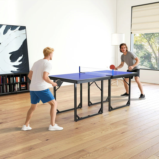 Two men playing ping pong on a blue table tennis table in a modern living room
