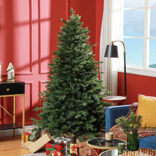 The artificial Christmas tree set up in a cosy room with presents underneath and a lamp nearby
