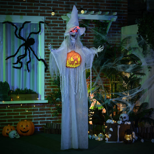 Hanging Halloween witch prop with pumpkin decoration in a garden setting