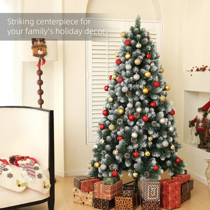 The artificial Christmas tree decorated with baubles and presents