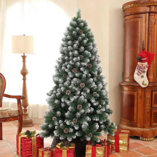 The artificial Christmas tree decorated with gifts and a lamp in a room