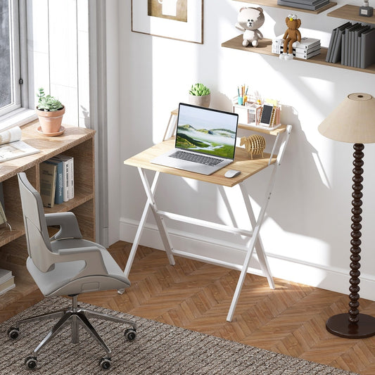 The folding computer desk is set up in a home office with a laptop and chair