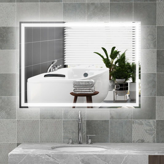 The illuminated bathroom mirror is mounted above a sink in a modern bathroom setting