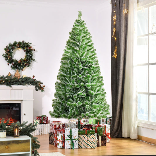 The artificial Christmas tree decorated with presents in a cosy living room setting
