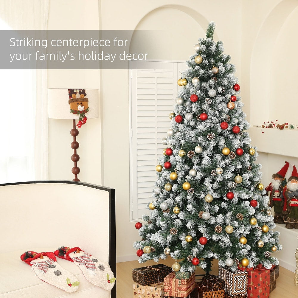 The artificial christmas tree decorated with red and gold baubles in a festive home