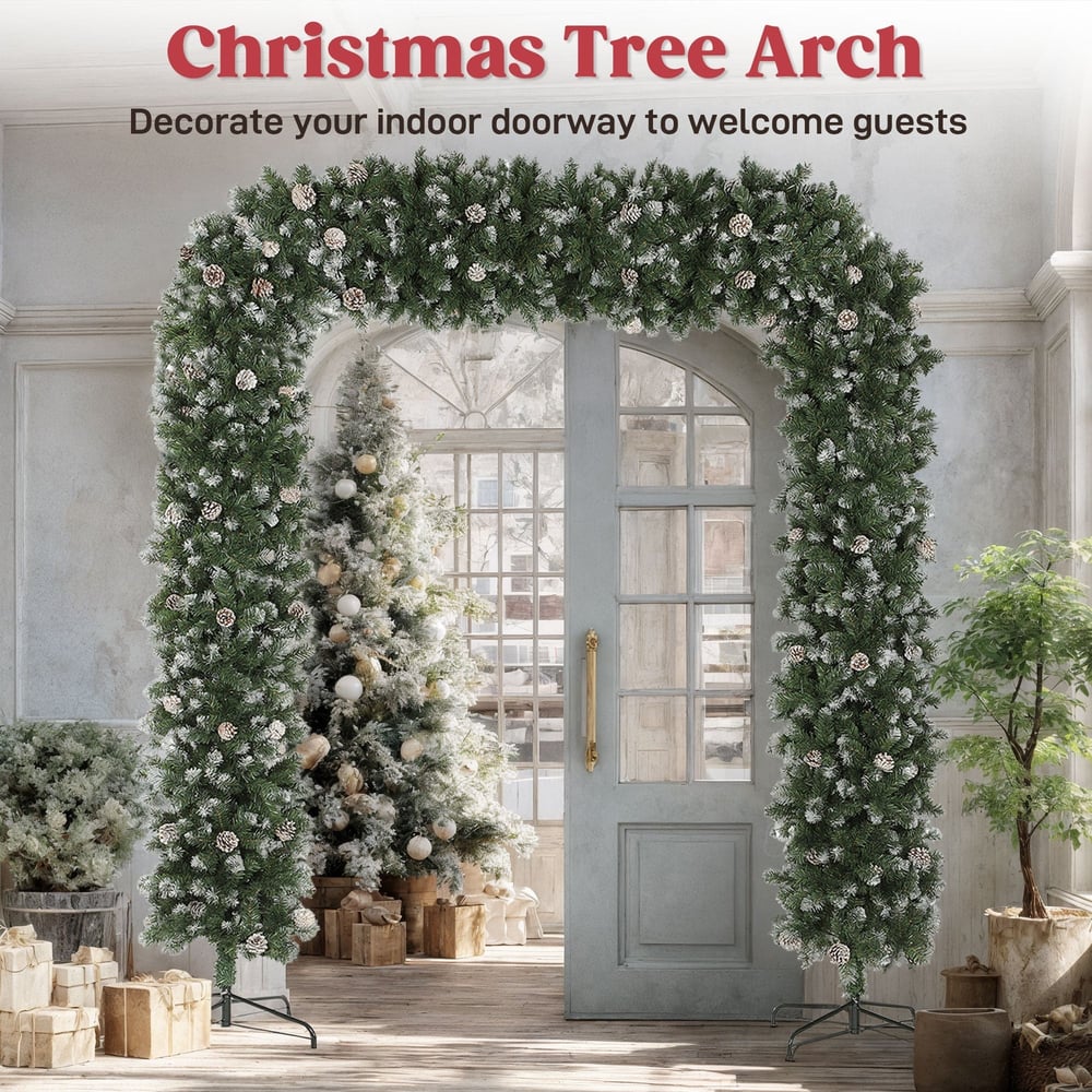 The Christmas tree arch decorated for indoor use with a Christmas tree behind