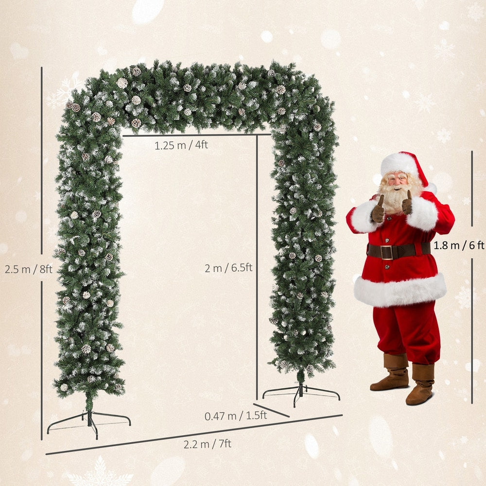 The artificial Christmas tree arch with dimensions shown next to Santa