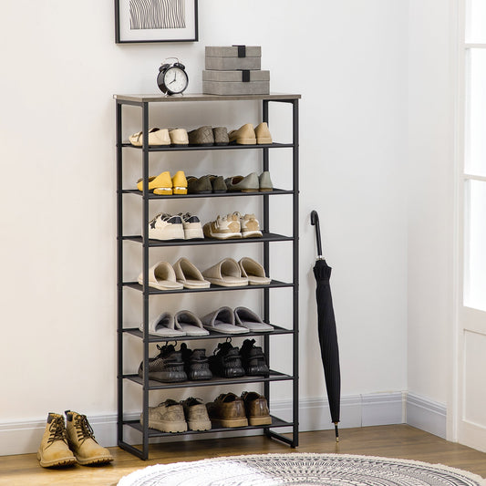 The shoe storage organiser in a hallway, holding 21 pairs of shoes and an umbrella