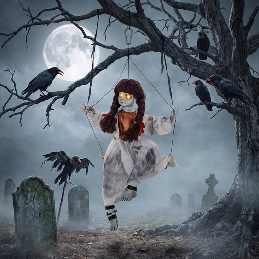The Halloween hanging doll on a swing in a spooky graveyard setting with crows and a full moon