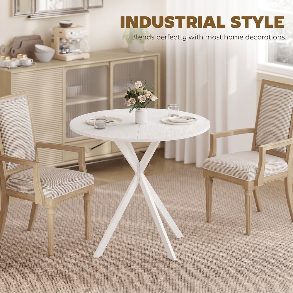 The white round dining table styled in a room with two chairs and a sideboard