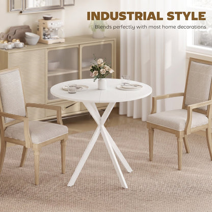 The white round dining table styled in a room with two chairs and a sideboard