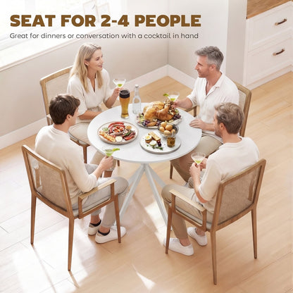 Four people sitting around the round dining table enjoying a meal