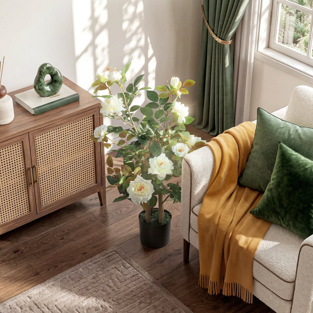 The artificial plant placed on a wooden floor next to a rattan cabinet and armchair