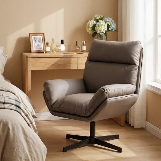 The armchair placed in a bedroom next to a wooden dressing table and a bed