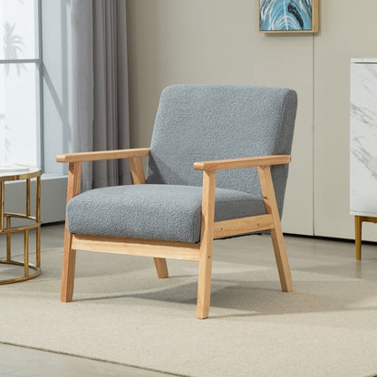 The grey accent chair placed in a bright living room setting with a rug and side table