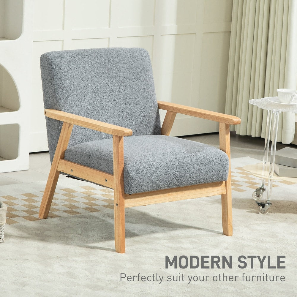 The grey armchair positioned in a minimalist interior space with modern furniture