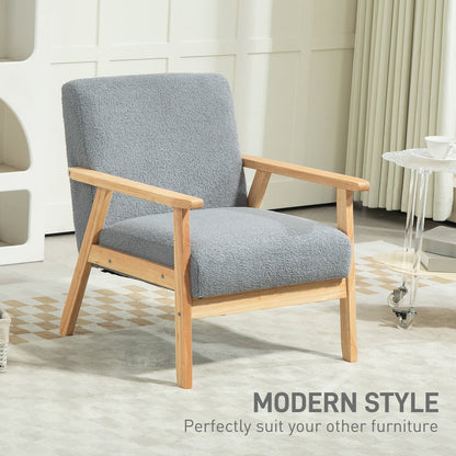 The grey armchair positioned in a minimalist interior space with modern furniture