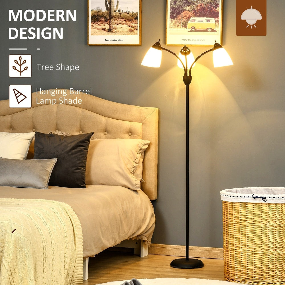 The arc tree floor lamp in a bedroom setting next to a bed