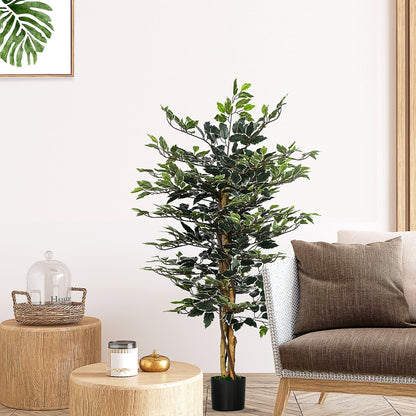 The artificial plant is placed in a living room setting next to a sofa and side table